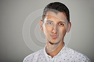 Headshot of young hispanic man