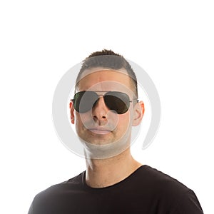 Headshot of a young man wearing aviator sunglasses,