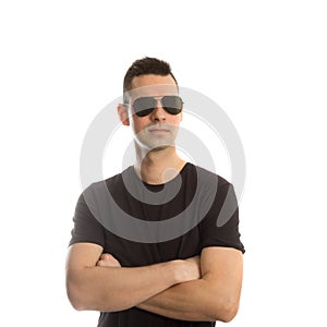 Headshot of a young man wearing aviator sunglasses,