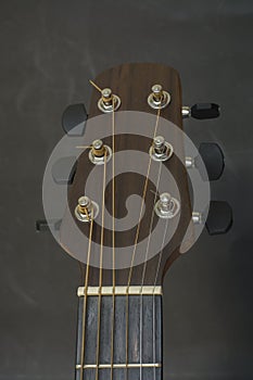 Headstock,fret bord,frets,tuners of guitar acoustic.