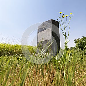 Headstone in field. photo