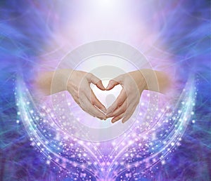 Healers hands making a humble heart shape