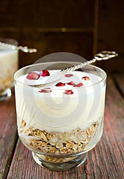 Healhty breakfast with oatmeal, yogurt and pomegranate berries