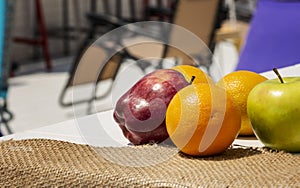 Healhty fruits, red apple, green apple and three oranges in composition