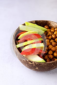 Healhty Vegan Lunch Bowl with Avocado Tomato Chickpeas Vegetables Salad Top View Vertical Copy Space