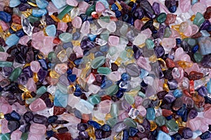 Healing Chakra Crystals Banner - Chakra colored tumbled healing stones. Crystal healing background photo