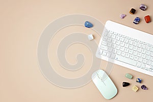 Healing chakra crystals and computer keyboard. Online application for rituals with gemstones