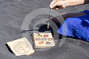 Healing crystals on black sand background