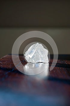 Healing crystals Clear Quartz on a wooden table. Gemstones are full of healing energy and good vibes