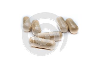 Healing earth capsules isolated white background