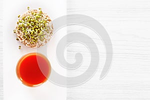 Healing food - sprouted grains, puffed wheat cake and fresh tomato juice.