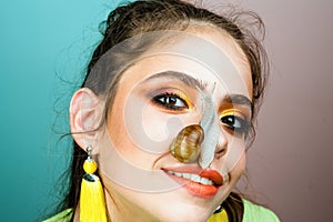 Healing mucus. Having fun with adorable snail. Cosmetics and snail mucus. Cosmetology beauty procedure. Girl fashionable