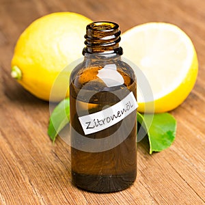 Healing plants: Lemon oil on wooden board with lemons