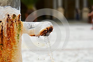 Healing thermal mineral water from hot mineral spring in famous spa town Karlovy Vary, Czech Republic