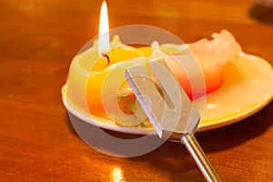 Healing tuning fork and crystal stone on table .