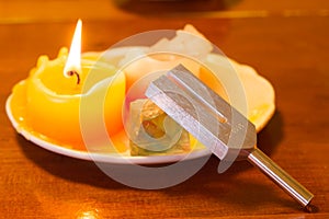 Healing tuning fork and crystal stone on table .