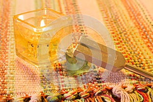 Healing tuning fork and crystal stone on table .