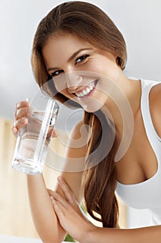 Health, Beauty, Diet Concept. Happy Woman Drinking Water. Drinks