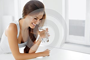 Health, Beauty, Diet Concept. Happy Woman Drinking Water. Drinks
