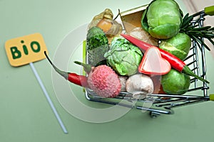 Health bio organic food concept, Shopping cart  in supermarket full of fruits and vegetables, .top view