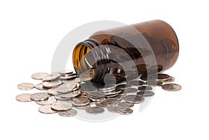 Health Care Coins in a Medicine Bottle