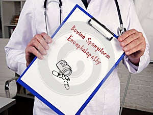 Health care concept about Bovine Spongiform Encephalopathy with inscription on the sheet