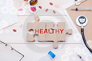 Health and care concept on jigsaw puzzle