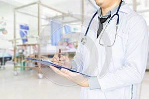 Health care, emergency room physician Writing a patient illness report