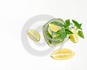 Health care, fitness, healthy nutrition diet concept. Fresh cool lemon cucumber mint infused water, cocktail, detox