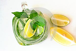 Health care, fitness, healthy nutrition diet concept. Fresh cool lemon cucumber mint infused water, cocktail, detox