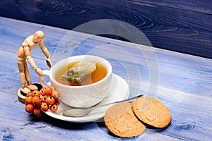 Health care folk remedies. Cup of tea on blue background close up. Gourmet delicious taste. Cafe menu. Berry tea