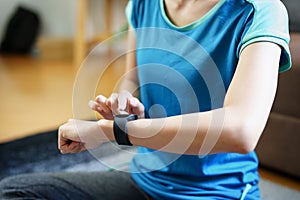 Health care, heart rate monitor, portrait of Asian beautiful woman using smart watch to select health programs such as