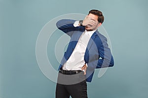 Health care. Man closed eyes and have discomfort in spine