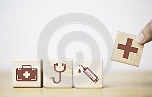 Health care and medical icons print screen on wooden block with connection linkage for healthy wellness insurance and assurance