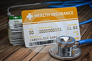 Health care medical Insurance card  and stethoscope as a symbol of  medicine on the wood background