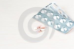 Health care and medicine.Close-up image of white and pink medicines