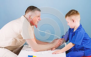 Health care. Pediatrician concept. Careful pediatrician check health of kid. Medical examination. Hospital worker
