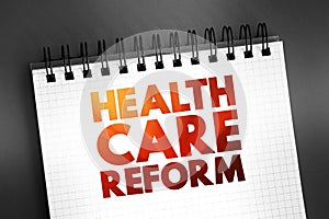 Health care reform - governmental policy that affects health care delivery in a given place, text concept on notepad