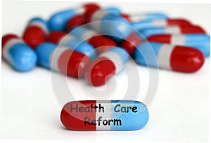 Health Care Reform pills isolated on white photo