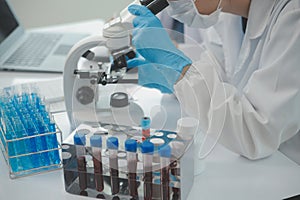 Health care researchers working in life science laboratory. Young female research scientist and senior male supervisor preparing