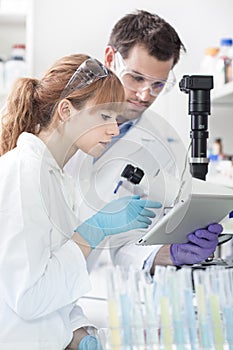 Health care researchers working in scientific laboratory.