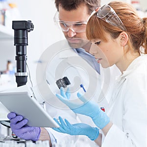 Health care researchers working in scientific laboratory.