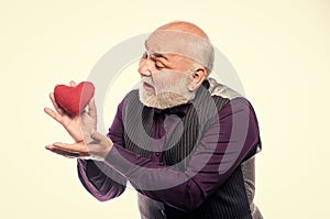 Health care. Senior bald head bearded man hold red heart. Preventing heart attack. Heart problem and healthcare. Mature