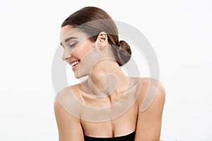 Health care and spa concept - attractive young and healthy woman with nude makeup on white background.