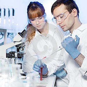 Health care students working in scientific laboratory.