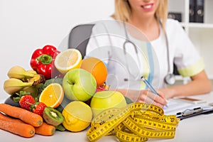 Health coach office with vegetables and tape measure