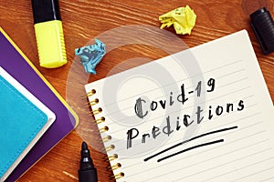 Health concept about covid predictions with sign on the piece of paper