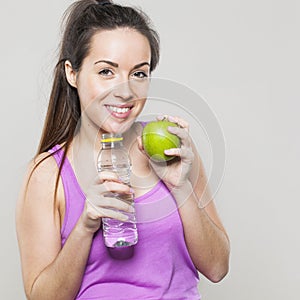 Health concious lady holding fruit and refreshing drink