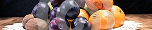 Health diet ingredients - fresh fruit: banana, plum, kiwi and orange