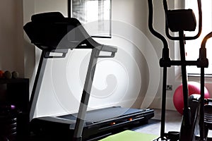 Health and fitness gym equipment in a home gym interior